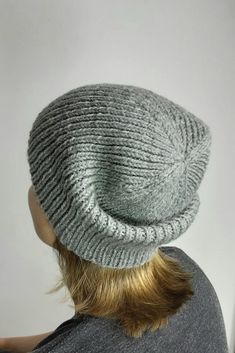 Hand-knitted hat made of 100% wool in gray. This knitted hat is handmade and therefore unique. It is available in one size and is perfect for winter and autumn. The style is a classic beanie that can be worn by both men and women. This wool hat is a must-have accessory for anyone who values craftsmanship and quality. Lovingly handcrafted. Circumference: 54 to 58 cm. Height: 23cm. Material: 100% wool Warm Gray Bonnet Cap, Merino Wool Knit Beanie, Warm Knit Gray Beanie, Warm Gray Bonnet One Size Fits Most, Warm Gray Knit Beanie, Gray Knitted Beanie Cap, Gray Knit Beanie, Gray One-size Beanie Cap, Warm Gray One Size Beanie