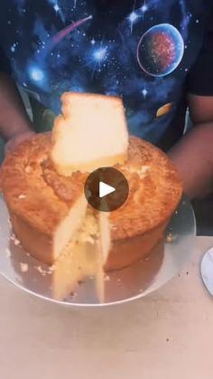 a person is cutting into a cake on a plate