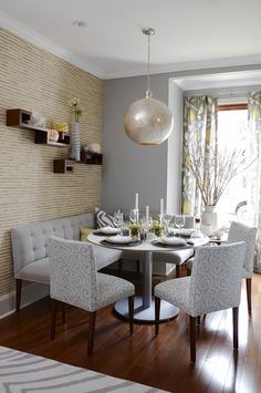 a dinning room table with chairs around it