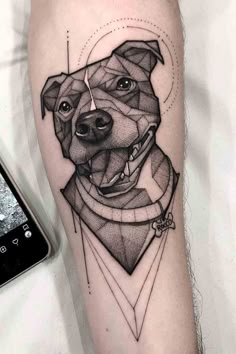 a black and white photo of a dog's face on the arm with geometric shapes