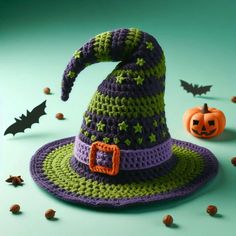 a crocheted witch hat with bats around it