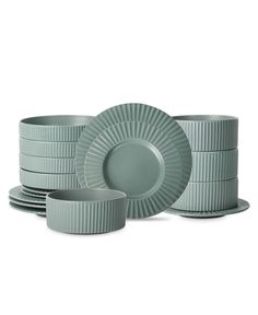 a stack of plates and bowls sitting next to each other