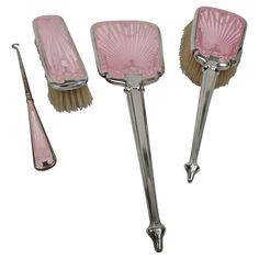 three pink shaving brushes and one brush on a white background with clippings