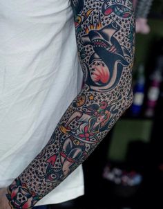 a man with a tattoo on his arm