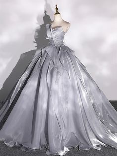 a dress is displayed on a mannequin in front of a white background with clouds