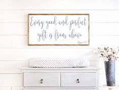 a white dresser with a sign above it that says, every good and perfect gift is from above