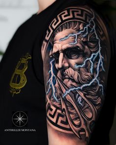 a man with a tattoo on his arm that has lightning coming out of the head