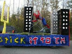 a truck with decorations on the back driving down a street