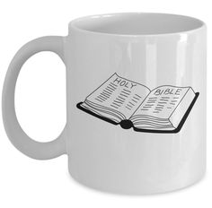 a white coffee mug with an open book on the inside, and black lettering that reads non