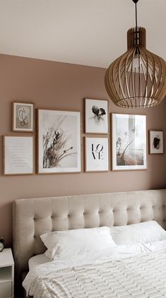 a bedroom with pictures on the wall and an image of a bed in front of it