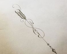 a drawing of a feather and an arrow on paper