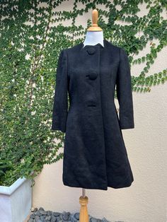 "For sale is a Vintage Tung Sum & co black alpaca long sleeve peacoat with super soft embroidered quilted silk lining and from button down closure. Two pockets on side. Absolutely beautiful piece in perfect condition! Made in Hong Kong, no size tag, see measurements below.  Measurements (flat) Shoulder to shoulder: 14\" approx Overall length: 37\" Armpit to armpit: 18\" Sleeve length: 20\"" Black Wool Coat With Button Cuffs For Formal Occasions, Formal Black Wool Coat With Button Cuffs, Black Evening Outerwear With Hidden Button Closure, Black Designer Wool Coat With Button Closure, Designer Long Sleeve Pea Coat For Winter, Wool Evening Outerwear With Buttons, Evening Wool Outerwear With Buttons, Fitted Black Wool Coat For Evening, Winter Wool Coat With Hidden Button Closure For Evening