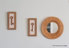 the wall is decorated with decorative items such as mirrors, keys and a ring holder