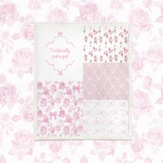 a pink and white wallpaper with flowers on it