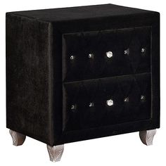 a black velvet night stand with silver studded accents on the front and bottom drawers