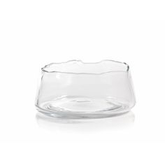 an empty glass bowl sitting on top of a white table