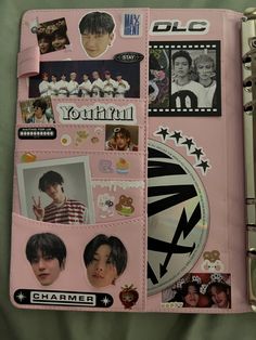 a pink binder with pictures and stickers on it