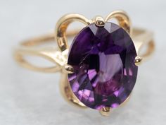 "Turn heads with this dazzling yellow gold oval cut amethyst solitaire ring! Crafted with stunning attention to detail, this is the ideal piece of jewelry for a night out or special occasion. Plus, it's sure to be an eye-catching conversation starter - so put it on and get ready to turn some heads! Metal: 10K Yellow Gold Gem: Amethyst 2.29 Carats Gem Measurements: 7.8 x 9.6 mm, Oval Ring Size: 5.25 Marks: \"10K DC\" Stamped on the inside band SKU #: A32184 Each piece has been identified and grad Yellow Gold Amethyst Ring, Black Hills Gold Rings, Amethyst Cocktail Ring, Gold Amethyst Ring, Black Hills Gold, Amethyst Gem, Oval Ring, Purple Band, Gold Gift