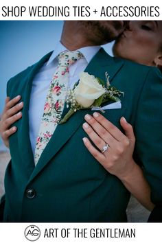 A bride and groom embracing each other on the beach wearing a green suit and a floral tie Groomsmen Colorful, Purple Earth Tones, Purple Earth, Floral Ties, Groom Wedding Attire, Wedding Picture Poses, Wedding Suits Groom, The Gentleman, Future Wedding Plans