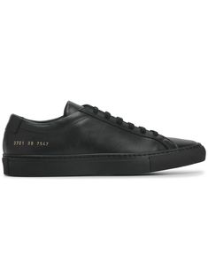 Common Projects Achilles Low sneakers - Black Black Classic Sneakers With Vulcanized Sole, Classic Black Sneakers With Contrast Sole, Luxury Black Sneakers With Rubber Sole, Casual Sneakers With Logo Plaque For Streetwear, Streetwear Lace-up Sneakers With Logo Plaque, Casual Streetwear Sneakers With Logo Plaque, Classic Black Sneakers With Leather Sole, Classic Low-top Formal Sneakers, Luxury Black Custom Sneakers With Vulcanized Sole