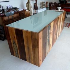 "Glass and recycled wood sales counter or reception desk. This reception counter or reception desk works for any office. A reception counter or reception desk is perfect for any retail store or office. You can pair up this item with any sales counter, cash wrap, sales desk, or display case, and custom furniture we have to offer! Dimensions: 72\"wide, 34\" deep, 30\" tall Free Shipping to all U.S. States excluding Alaska and Hawaii. Custom sizes available (Must Call Direct For Custom Sizes) **PRI White Reception Counter, Wooden Reception Desk, Wood Reception, Sales Counter, Wood Reception Desk, Cash Counter, Cash Wrap, Retail Counter, Modern Reception Desk