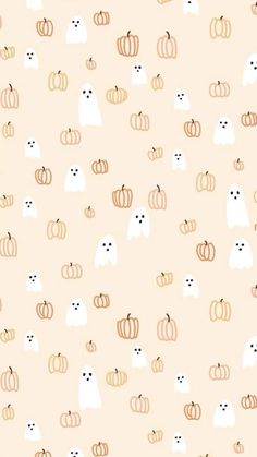 an orange and white pattern with cats, pumpkins and ghost faces