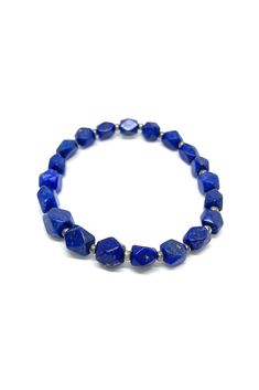 This brilliant Lapis Lazuli stretchy bracelet has been shaped into angled beads. Pair this bracelet with any outfit to add a 'pop' of beautiful blue. Lapis Lazuli dates back to 5000 B.C. and has been highly prized since ancient Babylonian and Egyptian times. The stone is mined in Chili, Siberia, Myanmar, and the United States. Lapis Lazuli, a manifestation stone, is excellent for meditation. It is believed to provide strength, wisdom, and truth. Measurements: 9" long Egyptian Bracelet, Stretchy Beaded Bracelet, Lapis Jewelry, Blue Lapis Lazuli, Silver Eagles, Blue Lapis, Stretchy Bracelets, Bead Bracelet, Myanmar