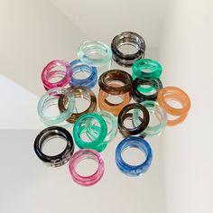 Handmade colourful resin rings.  All rings are made by hand with epoxy resin and dye, due to this no two rings are identical. There will be slight differences in colour and patterns of all the rings available. A large range of ring sizes are available on request for all colours displayed on our shop. Accessories Photo Ideas, Y2k Beads, Rings Y2k, Epoxy Ring, Y2k Jewellery, Nice Rings, Resin Business, Photography Set Up, Jewlery Rings