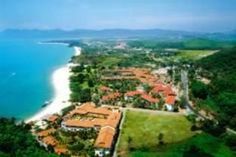 an aerial view of the resort and beach