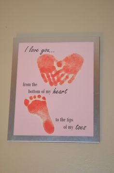 a hand and foot print on a pink card that says i love you from the bottom of my heart to the tips of my toes