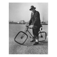 an old man is standing next to his bicycle