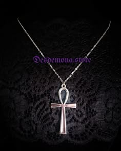 A large and solid Ankh Cross pendant on extra large chain! This hieroglyphic symbol was used by the ancient Egyptians to represent eternal life, rebirth and the union of male and female. Made of corrosion and tarnish resistant solid zinc alloy on a stainless steel chain. Charm measures 5cm high and 3cm wide (approx.) Chain extends from 60 to 70 cm circumference (approx.) with lobster claw fastening. Symbolic Metal Cross Necklace, Silver Ankh Gothic Necklace, Gothic Ankh Necklace In Metal, Gothic Ankh Metal Necklace, Gothic Ankh Jewelry For Gift, Goth Outfit Ideas, Cross Charm Necklace, Ankh Cross, Goth Outfit