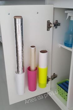 three rolls of duct tape in a cabinet