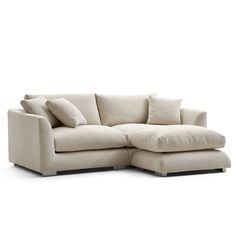 a white couch with pillows on it