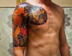 a man with a tattoo on his arm and chest