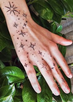 a woman's hand with stars on it