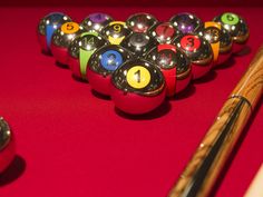 the pool balls are lined up on the table