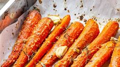 carrots with herbs and seasoning in a pan