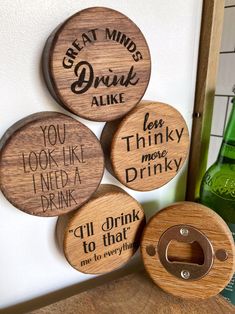 four wooden coasters that say great minds drink alike, you look like i need more drink