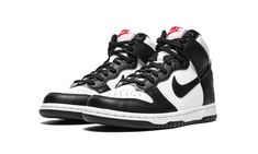 The Nike Dunk High GS “Black/White” is the youth sizing of the highly versatile colorway of the legendary high-top shoe.  Arriving in the same two-tone look as many a classic Nike Dunk, the aptly named “Black/White” features a black-and-white color block that is both endlessly versatile and always fresh.  The base of the shoe is constructed from crisp white tumbled leather.  Black leather can be found on the forefoot, eyelets, heel, and Swoosh.  A red “Nike” logo with a Swoosh appears on the whi Red Nike Logo, High Top Nike, Black White Shoes, High Top Shoe, White High Tops, Black And White Shoes, Dunks Nike, Nike Dunk High, Dunk High