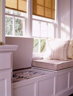 a laptop computer sitting on top of a window sill