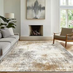 a living room filled with furniture and a painting hanging on the wall over a fire place