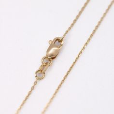 This exquisite solid gold chain is made with expert craftsmanship and is perfect for daily use. Unisex Precious Metal: 14K Yellow Gold Length: 16” Lock: Lobster Lock Comes in our beautiful gift box Other chains and pendants shown on the pictures are sold separately ***Note: Prices and availability are subject to change without notice. Follow us on Instagram 14k Gold Cable Chain Necklace With Round Pendant, Yellow Gold Round Cable Chain Necklace, Yellow Gold Rolo Chain Necklace With Round Pendant, Fine Jewelry 14k Gold Diamond Necklace With Cable Chain, 14k Gold Necklace With Rolo Chain, White Gold Plated Cable Chain Necklace, Delicate 14k Gold Diamond Necklace With Cable Chain, White Gold Plated Necklace With Cable Chain, 14k Gold Diamond Necklace With Cable Chain For Anniversary