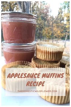 applesauce muffins are stacked on top of each other in front of a jar