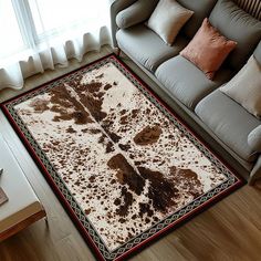 a living room with a couch and rug on the floor