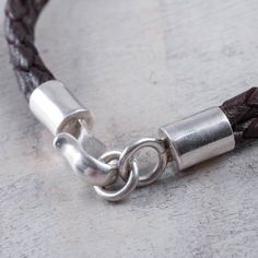 Handmade Men's Sterling Silver and Leather Bracelet - Naturally | NOVICA Adjustable Brown Sterling Silver Bracelets, Adjustable Sterling Silver Bracelet With Stainless Steel Clasp, Everyday Silver Leather Braided Bracelet, Classic Braided Leather Jewelry, Silver Leather Bracelets For Everyday, Handmade Brown Sterling Silver Bracelets, Handmade Sterling Silver Braided Bracelet, Handmade Sterling Silver Brown Bracelet, Braided Silver Leather Jewelry