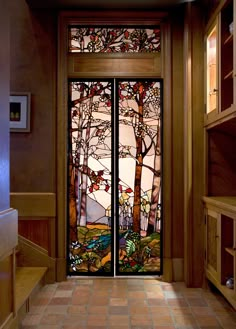 an entryway with two stained glass doors