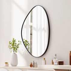 a mirror on the wall above a white table