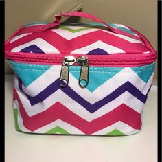 Gil Print Canvas Makeup Bag. Small Handle On Top With Zip Around Closure. Lightly Lined. Nice Bag For Makeup, Small Toys, School Supplies, Or Art Supplies. Measurements Are Approximately As Follows: Width: 4.5 Inches Length: 7.5 Inches Height: 4.5 Inches Theme: Pink Chevron Print Multicolor School Bag With Zipper Pouch, Trendy Multicolor Cosmetic Bag With Zipper Closure, Trendy Multicolor Cosmetic Bag With Zipper, Pink Casual Cosmetic Bag With Zipper Closure, Cute Multicolor Bag With Zipper Pouch, Casual Pink Cosmetic Bag With Zipper, Trendy Multicolor Cosmetic Bag With Removable Pouch, Casual Pink Cosmetic Bag For Daily Use, Cute Pink Travel Cosmetic Bag