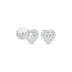 Feminine and romantic, these earrings feature two perfectly matching heart-shaped diamonds, ethically sourced and hand-selected for maximum brilliance. The hero diamonds are framed by shimmering halos of micropavé, for a total of ~0.60 carats. Unique yet understated, these earrings wear beautifully alongside other styles from the collection. White Heart Cut Earrings With Vvs Clarity, White Vvs Clarity Heart Cut Earrings, Silver Diamond Earrings With Brilliant Cut For Valentine's Day, Diamond Heart Cut Earrings For Anniversary, White Heart Cut Diamond Earrings For Formal Occasions, Heart-shaped Vvs Clarity Diamond Earrings For Formal Occasions, Formal Heart Cut Diamond Earrings, Heart Cut White Diamond Earrings For Anniversary, Diamond White Heart Cut Diamond Earrings For Formal Occasions